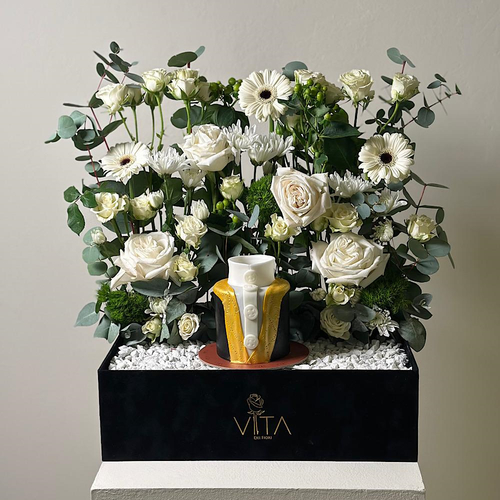 Belum - A bouquet containing roses, gerberas, and chrysanthemums, hypericum, arranged beautifully in a box with a bisht-shaped cake. Height: 55 cm Width: 40 cm