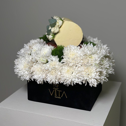 Linz - A black box containing white chrysanthemums and green leaves, arranged beautifully with a cake. Height: 30 Width: 20