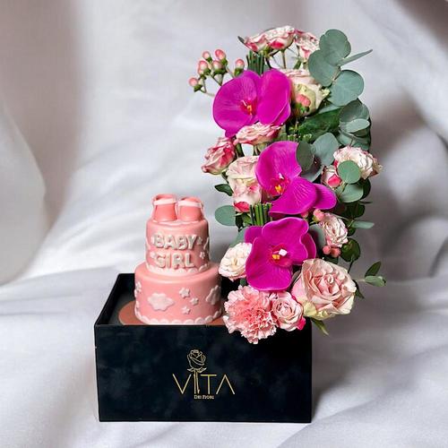 Lauri - A black box that contains pink roses, carnations and pink baby roses, purple hypericum cut flowers and eucalyptus leaves. comes with a two layered baby girl cake. Height: 50 Width: 20