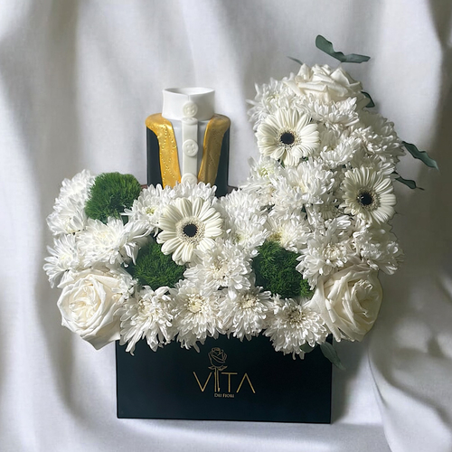 Royal - A bouquet containing roses, gerberas, and chrysanthemums, arranged beautifully in a box with a bisht-shaped cake. Height: 35 cm Width: 20 cm