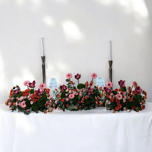 Bonn - Reception arrangements containing1.20 CM sweet table , 80 cm meter center , 4 pcs and 2 pcs side tableAnd 4 small floral arrangements type of flowers with pink and orange baby roses, purple cymbidium, gerbera and green leaves.Note : not included the candels and light