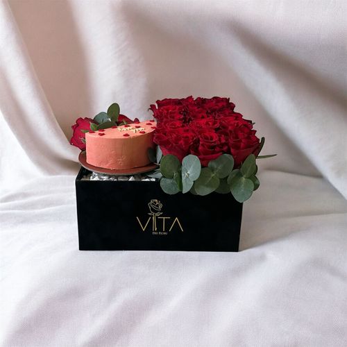 Tulln - A black box contains red roses, and green leaves with cake. Height: 25 Width: 20