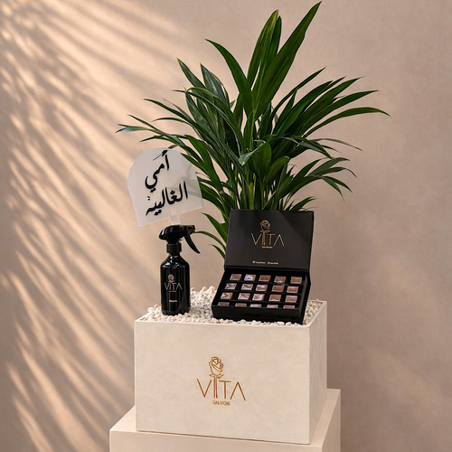 Green Treat - A box featuring butterfly palm with chocolate, home fragrance and a topper. Height: 50 Width: 20