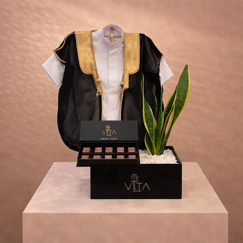 Spring Whisper - Black box contains Snake plant with baby deshdasha, baby bisht and a box of chocolates. Height: 50 Width: 20