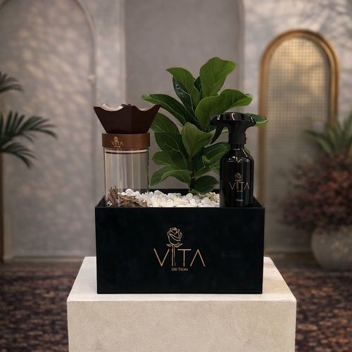 Planty - A bouquet containing a fiddle leaf fig plant with a home spray, an with mubkhar with an empty space down to place the bakour. Height: 50 Width: 20