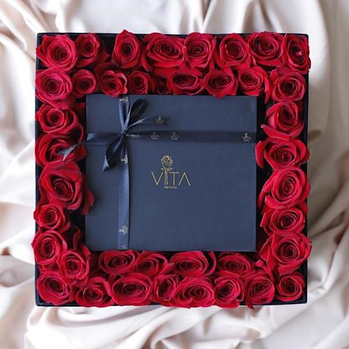 dif - black box contains red roses and middle diffuser and candle