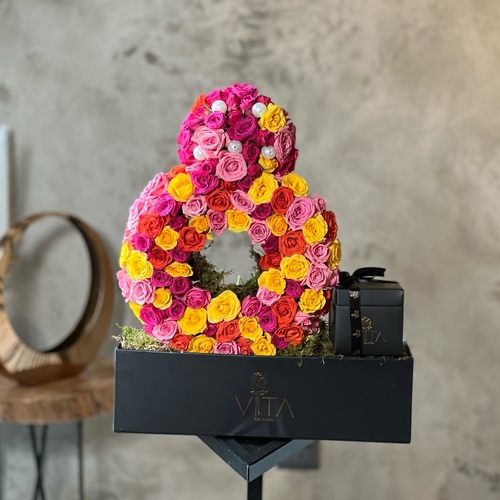 voko - Black box contains yellow, pink and fuchsia baby roses with box of chocolates 
 H: 50 w : 40