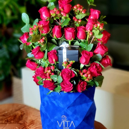 follow - Blue box contains red roses and green leaves  with box of chocolate  H 60 w 30