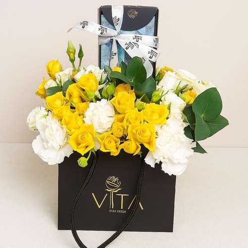 tashas - Black bag contains mixed flowers with money box