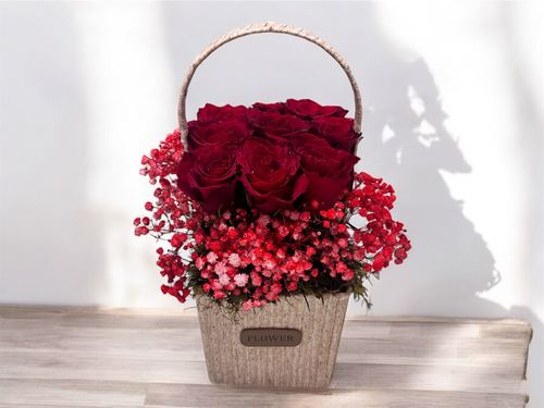 LOV 2 - Basket
  with a bunch of natural flowers