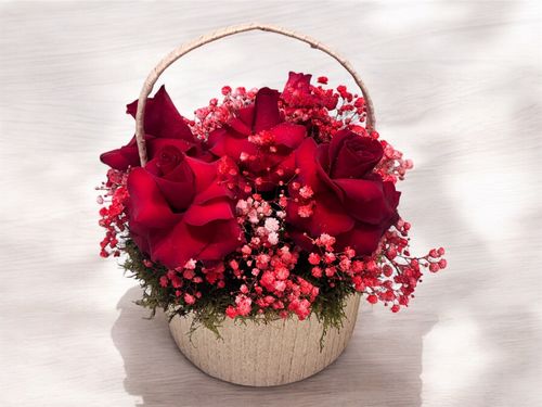 LOV 5 - Basket
  with a bunch of natural flowers