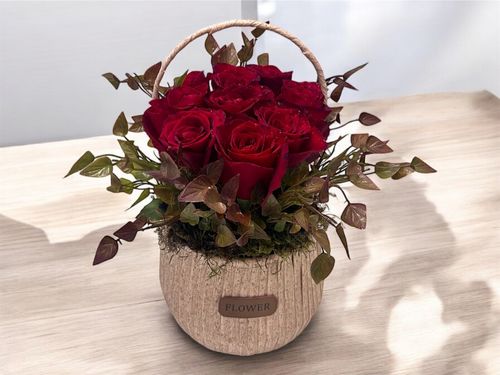 LOV 6 - Basket
  with a bunch of natural flowers