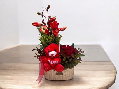 LOV 10 - Basket
  with a bunch of natural flowers