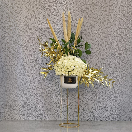 Golden White XIII - Height: 90 cm
Width: 60 cm
 A stand contains typha flowers, baby roses and ruscus.