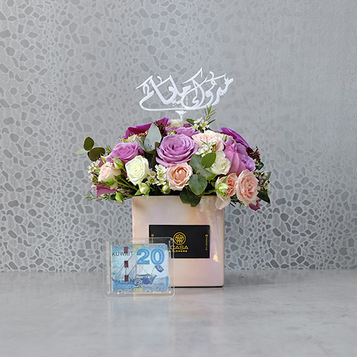 Lashay - Height: 30 cm
Width: 30 cm
 A box contains roses, baby roses and orchid flowers with an acrylic money box. Note: money not included