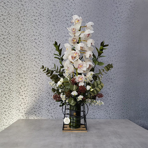 Casa Event Flowers - Louisa 1 - Height: 80 cm
Width: 50 cm

This vase contains cymbidium flowers and skimmia .