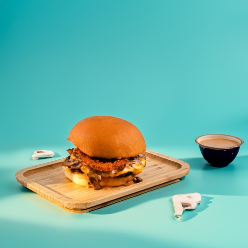 Smoked Beach Burger - Beef patty, grilled mushroom, onion rings and tillamook cheddar cheese