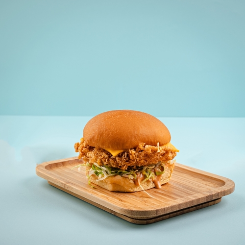 Miami Chicken Burger - Crispy fried chicken breast, lettuce and American cheese.