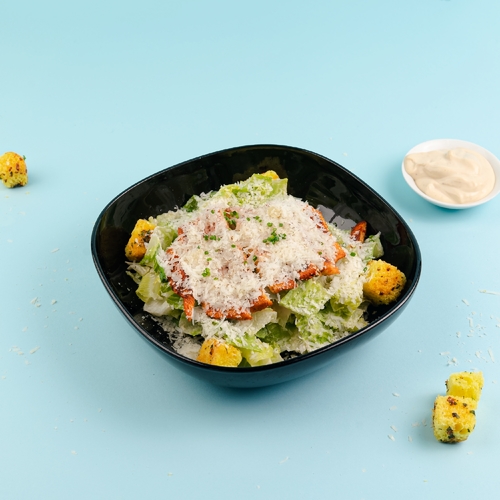 Caesar Salad - Marinated grilled chicken breast, romaine lettuce, parmesan cheese, croutons and caesar sauce.