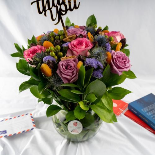 Fruit Flower - Small Dried Fruit Vase 501 - 8 Pink roses  3 purple Statics 3 Eryngium 4 green Hypricum 5 green ruscus
10 apricot 10 dates 5 figs. Height 40 cm width 30 cm