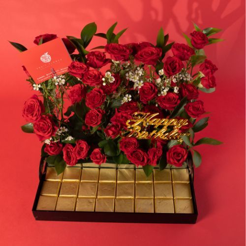 Baby Red baby Roses and wax Flowers, and Ruscus With Wafer Chocolate in acrylic tray 1702 - Baby Red baby Roses with wax Flowers, and Ruscus With Wafer Chocolate in acrylic tray 
 dimensions  Length 35 cm Width 25 cm Hight 27 cm