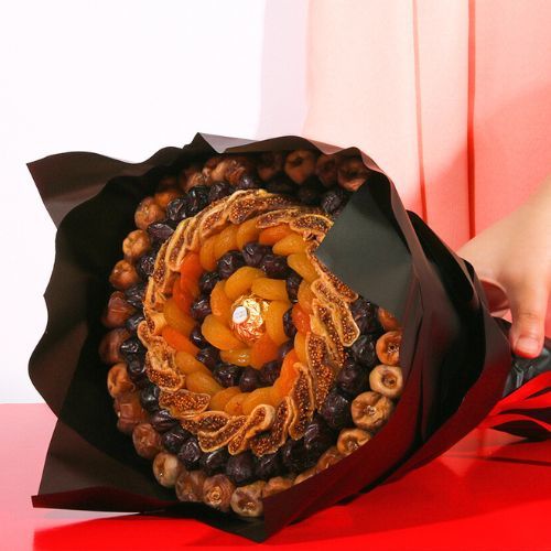 Amazing 1003 - The luxurious Safawi and saqi dates, dried figs, the soft dried apricots and the a Ferrero Rocher chocolate piece in the middle Diameter(width) is 30 cm Height is 35 cm