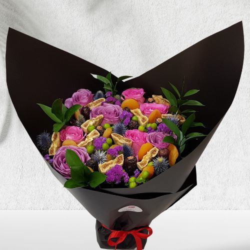 Flowers Dried Fruits Bouquet 1005 - A dried fruits bouquet with flowers that contains 8 pink roses, 3 Eryngium, 3 Purple statice, 4 Green Hypricum, 5 Green ruscus, 10 apricots, 10 dates and 5 figs Height 45cm X width 35cm