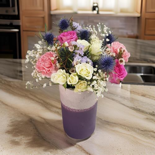 Multicolored flowers in vase 529 - This elegant vase showcases a beautiful arrangement of pink roses, pink carnations, baby white roses, eryngium, white wax flowers, and delicate white gypsophilia. Perfectly placed on a countertop, it adds a touch of charm and freshness to any space. Ideal for brightening up your home or as a thoughtful gift for loved ones,This elegant vase, standing at 40 cm in height and 30 cm in width.