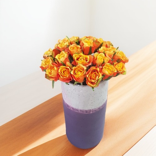 orange artificial baby roses in vase 1805 - Enhance the ambiance of any space with these stunning orange baby roses in a purple vase. The vibrant orange hue of the roses adds a pop of color, while the purple vase complements the flowers beautifully.  Perfect for both home and office settings, these artificial flowers require no maintenance and will maintain their beauty for years to come.  With a height of 30 cm and a width of 18 cm