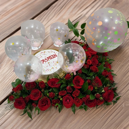 cake in a tray with flowers 1904 - The tray Includes Red Roses, red Baby Roses, Italian rescus, green rescus , And Green 
 The Arrangement Contains 7 inch chocolate cake for 2 to 4 person and  Balloons In A tray. Height 35 cm Width 50 cm