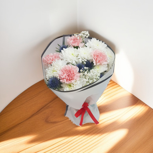 White Craze and carnation,with Gypsophilia and Eryngium boutique 1103 - A stunning and elegant bouquet featuring a mix of (White Craze), delicate carnation, soft gypsophila (baby's breath), and striking blue eryngium (thistle). This arrangement combines romantic, soft textures with a touch of bold color.The combination of the flowers creates a balance of beauty and sophistication, with a hint of wild charm from the eryngium. 
 height 40CM width 25CM