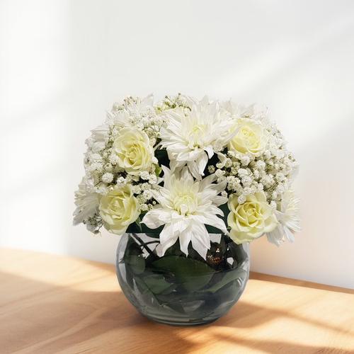 The White - White Craze And White Baby Rose In Medium  Round Glass Vase 519 - Baby Rose White, White Craze, Gypsophilia And Green Ruscus In Round Glass Vase.  Height- 20 cm Width- 20 cm