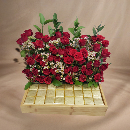 Baby Red baby Roses and wax Flowers, and Ruscus With Wafer Chocolate in acrylic tray 1702 - Baby Red baby Roses with wax Flowers, and Ruscus With Wafer Chocolate in acrylic tray 
 dimensions  Length 35 cm Width 25 cm Hight 27 cm