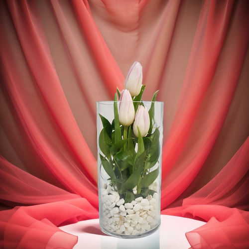 Tulip in Glass Vase 518 - Pink Tulip and green rescuss With White Stone in Glass Vase Dimensions
Height 20 cm Width 10 cm