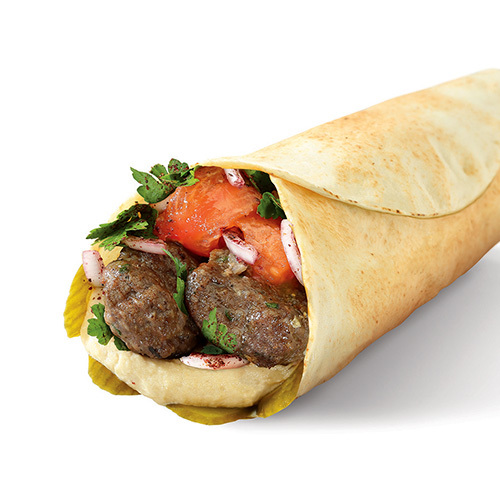 Classic Kabab Sandwich - Grilled kebab halabi, hummus, grilled tomato and onion, biwaz & pickels in Lebanese bread.