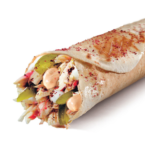 Special Chicken Sandwich - Grilled chicken, garlic & Little spicy sauce, pickles, sumac in Lebanese bread toasted over charcoal.