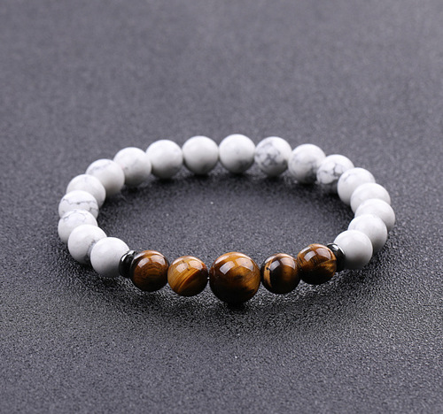 Handmade Real Natural Gemstone Beads Bracelets - Tiger Eye & White Howlite Stone - Overview & Details Color: Tiger Eye & White Howlite Stone Material: Natural stone Gender: Unisex Type: Bracelets 8mm beads with one 10mm middle bead 22cm – Stretchy elastic Bracelet weight: 22g The stone color will NOT fade Nickel & Zinc Free