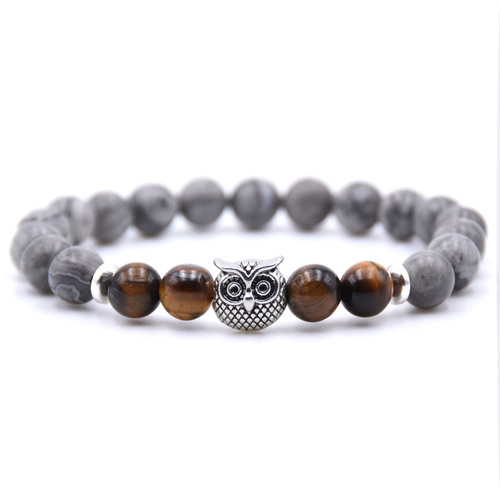 Jade Owl Pendant Stone Bracelet - Tiger Eye Stone - Overview & Details Color: Grey Jade Stone with Tiger Eye Stone Material: Natural stone Gender: Unisex Type: Bracelets 8mm beads 19cm – Stretchy elastic Bracelet weight: 23g The stone color will NOT fade Nickel & Zinc Free