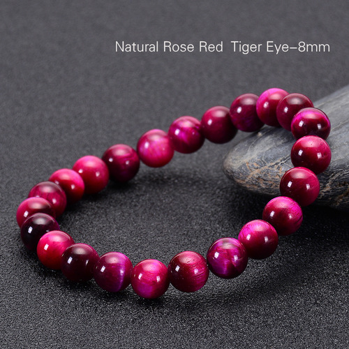 Hand Made Natural Stone Jade Bracelet - 8mm - Overview & Details Color: Rose Red Tiger's Eye Stone Material: Natural stone Gender: Unisex Type: Bracelets 8mm beads 18.5cm – Stretchy elastic Bracelet weight: 20g The stone color will NOT fade Nickel & Zinc Free