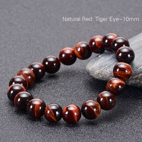 Bohemia Natural Stone Bracelet - 10mm - Overview & Details Color: Red Tiger's Eye Stone Material: Natural stone Gender: Unisex Type: Bracelets 10mm beads 18.5cm – Stretchy elastic Bracelet weight: 30g The stone color will NOT fade Nickel & Zinc Free