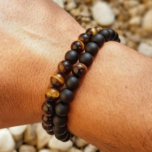 Charm Natural Stone Elastic Bracelet - Black & Tiger Eye - Overview & Details Color: Black & Tiger Eye Material: Natural stone Gender: Unisex Type: Bracelets 8mm beads 18.5cm – Stretchy elastic Bracelet weight: 35g The stone color will NOT fade Nickel & Zinc Free 2 Bracelets