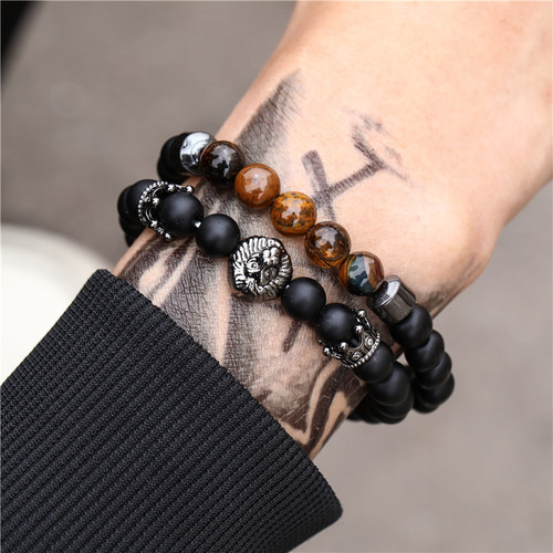 Charm Natural Stone Elastic Bracelet - Tiger Eye & Black - Overview & Details Color: Tiger Eye & Black Material: Natural stone Gender: Unisex Type: Bracelets 8mm beads 19cm – Stretchy elastic Bracelet weight: 40g The stone color will NOT fade Nickel & Zinc Free 2 Bracelets