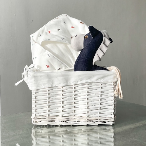 The white basket - The product contains a basket with a crib for the baby and a small toy horse.