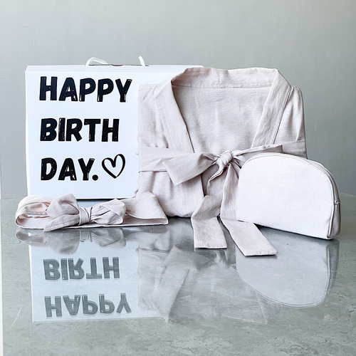 Birthday robe - The product contains one size linen robe with a makeup bag and a hair tie.