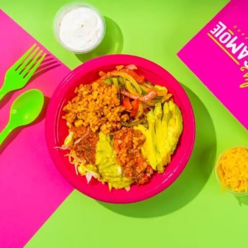 Mexico City Vegetable Rice Bowl 🥣 - Grilled Mixed Vegetable with Mexican Rice, Iceberg Lettuce, topped with Fresh Avocado, Guacamole, Pico de Gallo, Salsa and Shredded Cheese served with Home Made Sour Cream.