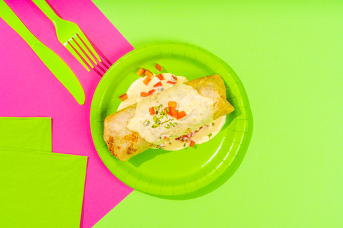 Breakfast Enchilada - Tortilla filled with Creamy Egg, Fresh Guacamole, Red
  Salsa, Pico de Gallo topped with Home Made HG Signature Cheese Sauce and
  chopped Coriander.