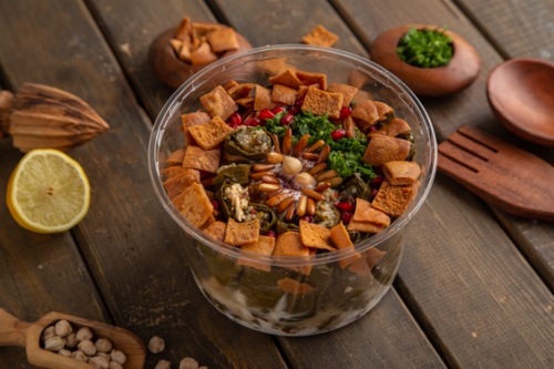 Waraq Anab Fatta - Vine leaves, hummus, pomegranate, sumac, parsley with special sauce. Served with toasted bread.